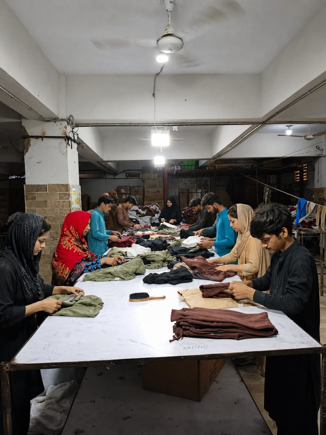Sorting and checking floor at RM Traders, Karachi